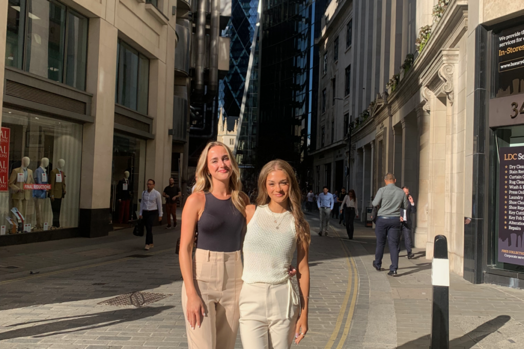 Photo of two marketing interns at REG Technologies taken in City of London